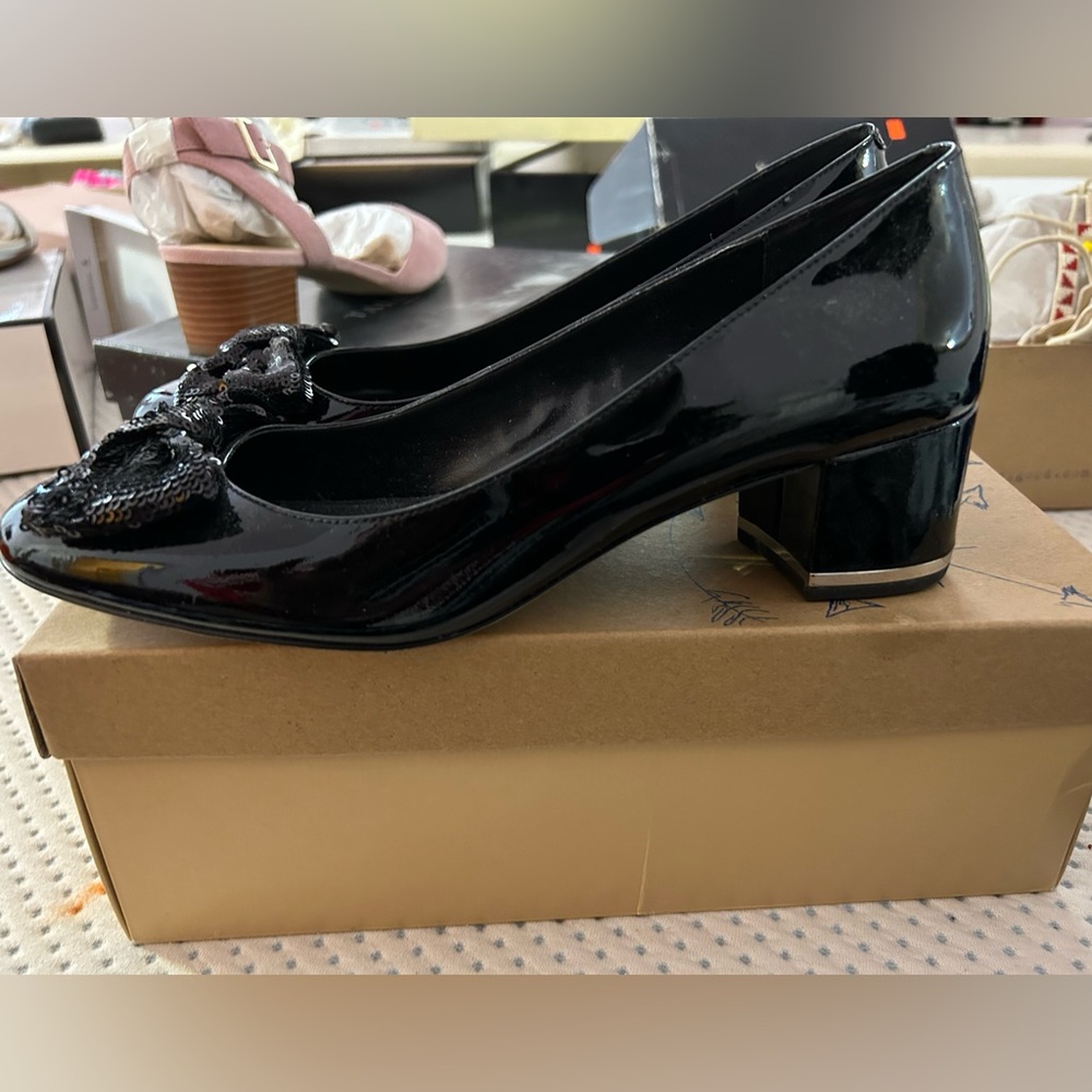 Michael Kors black patent leather pumps with sequin bow.